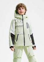 Boy wearing a pale green insulated ski jacket with hood up, colourblock white and black sleeves, standing against a plain backdrop