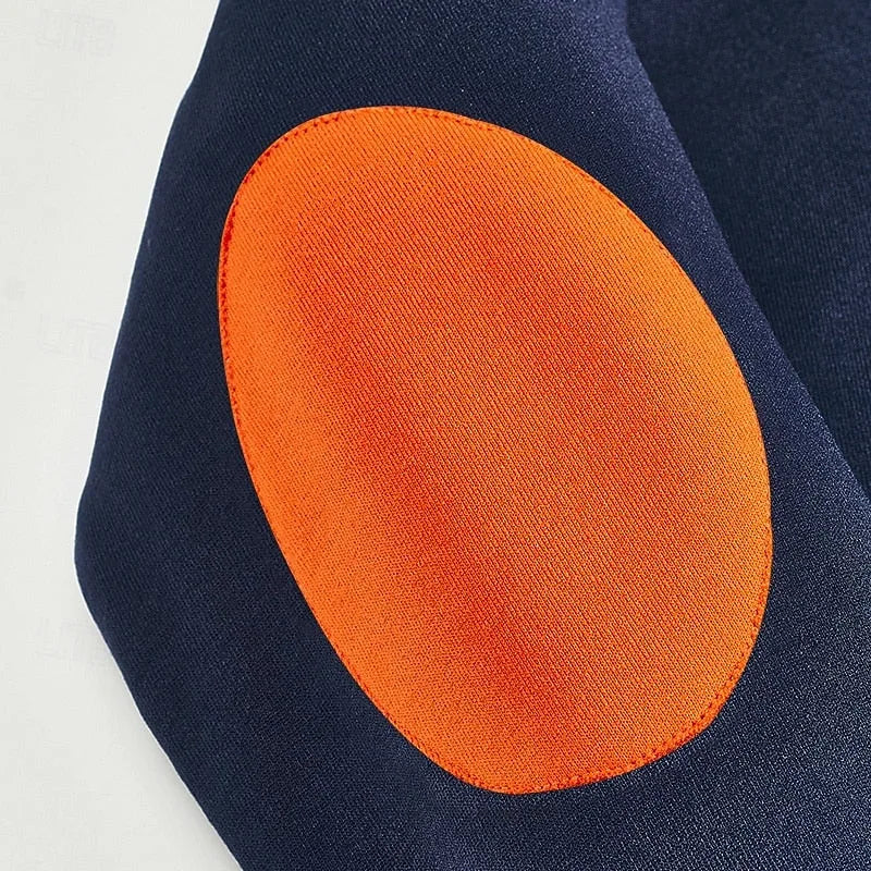 Close-up of the orange elbow patch stitched onto the navy blue sleeve