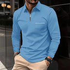 Sky blue quarter-zip polo shirt with classic collar and zip pull, paired with beige trousers for a smart casual look