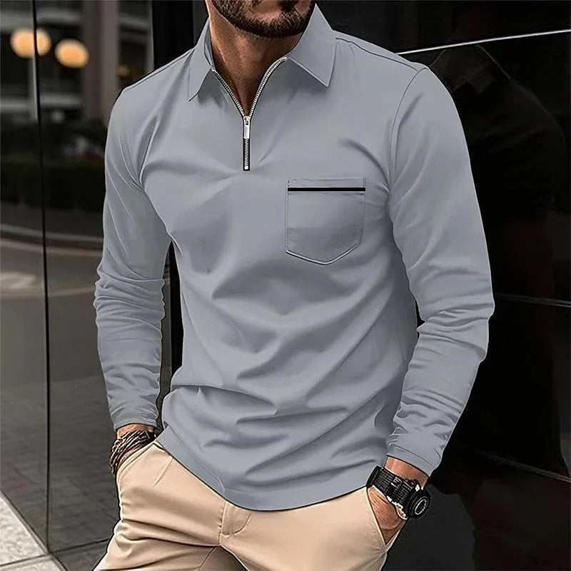 Grey quarter-zip polo shirt with collar, silver zip and chest pocket, close-up front view