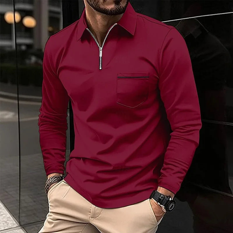 Wine red long-sleeve quarter-zip polo shirt with striped pocket detail, styled with beige trousers