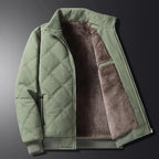 Full front view of the black jacket zipped up, showing the stand collar and diamond-quilted panels