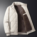 Close-up of the zip pull and stitched quilting pattern on the front chest area of the black jacket