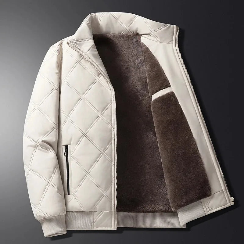 Close-up of the zip pull and stitched quilting pattern on the front chest area of the black jacket