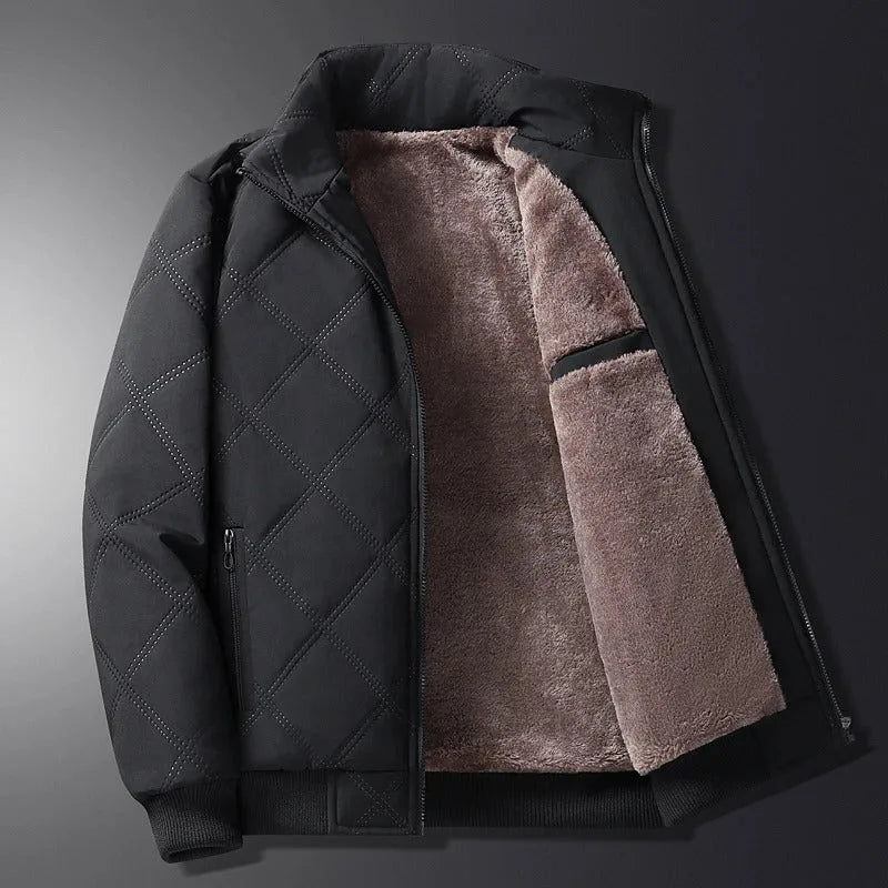 Black quilted jacket open on dark background, contrasting outer shell with warm taupe fleece lining and stand collar