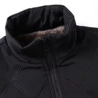 Close-up of the black stand collar unzipped, showing shell fabric against the thick fleece lining