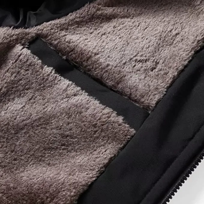 Detail shot of the dense taupe fleece lining and inner zipped pocket sewn into the jacket body