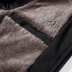 Detail shot of the dense taupe fleece lining and inner zipped pocket sewn into the jacket body