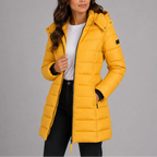 Mustard yellow channel-quilted puffer jacket with snap-fastened hood and ribbed cuffs, front view