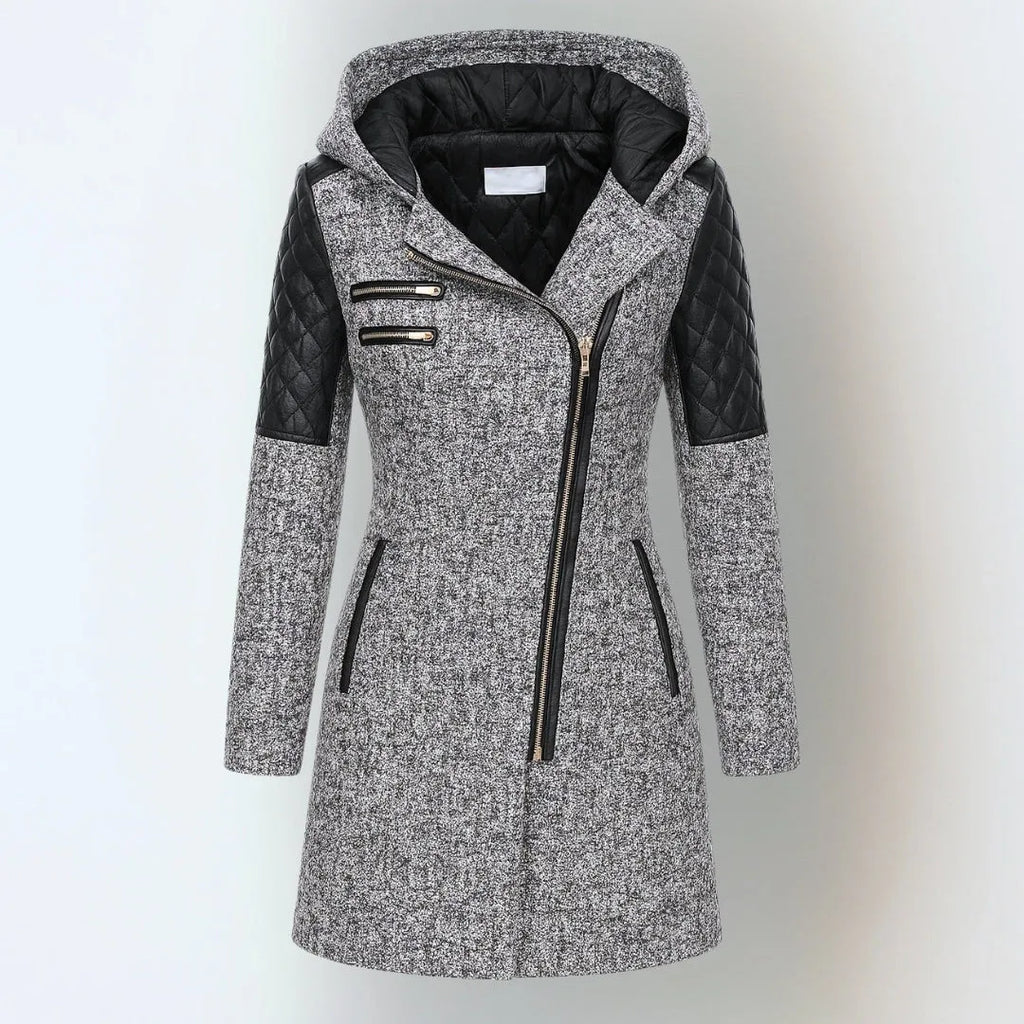 Front view of a light grey wool-blend hooded coat with black quilted leather shoulder panels and asymmetric zip