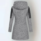 Back view of a light grey marl coat showing the hood and quilted leather panels on the sleeves