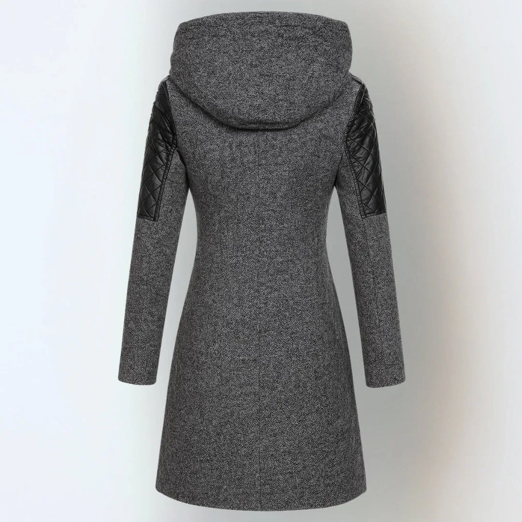 Back view of a dark grey wool-blend hooded coat with black quilted leather sleeve inserts