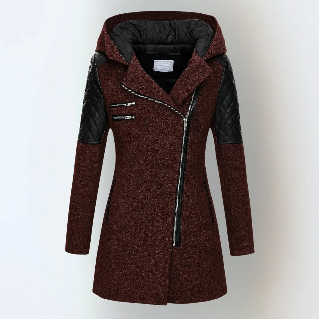 Front view of a burgundy red hooded coat with black quilted leather sleeves and side zip pockets
