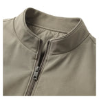 Close-up of the stand collar and zip pull showing the quilted lining detail at the neckline