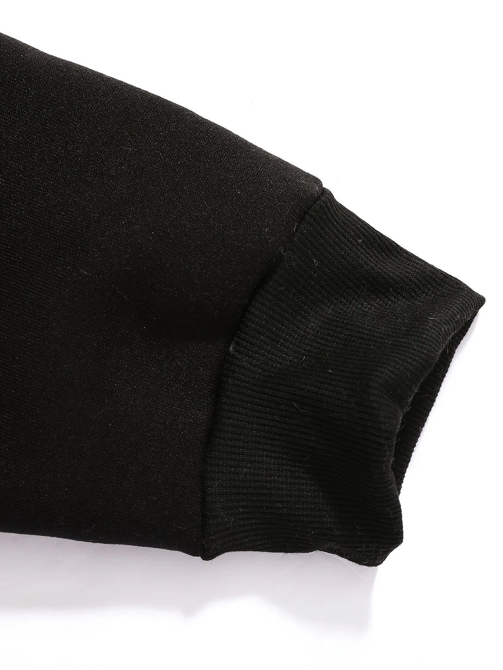 Close-up detail of the raglan sleeve seam running from the collar to the underarm
