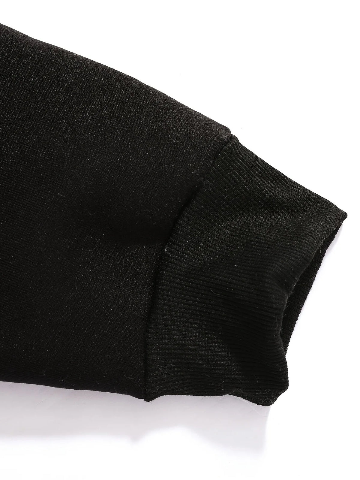 Close-up detail of the raglan sleeve seam running from the collar to the underarm