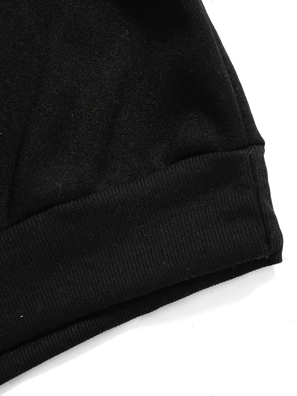 Close-up of the raglan sleeve and shoulder seam in the black colourway