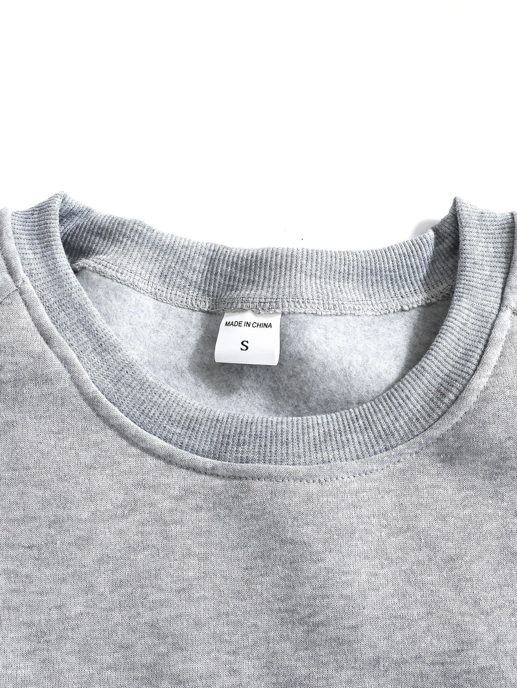 Close-up of the sleeve cuff stitching and ribbed knit texture