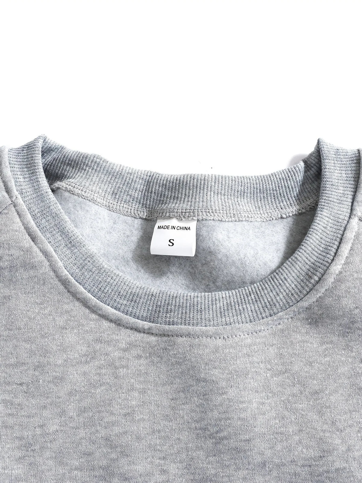 Close-up of the sleeve cuff stitching and ribbed knit texture