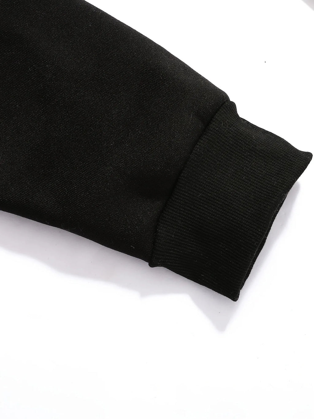 Close-up of the ribbed black cuff and brushed sleeve fabric texture