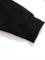 Close-up of the ribbed black cuff and brushed sleeve fabric texture
