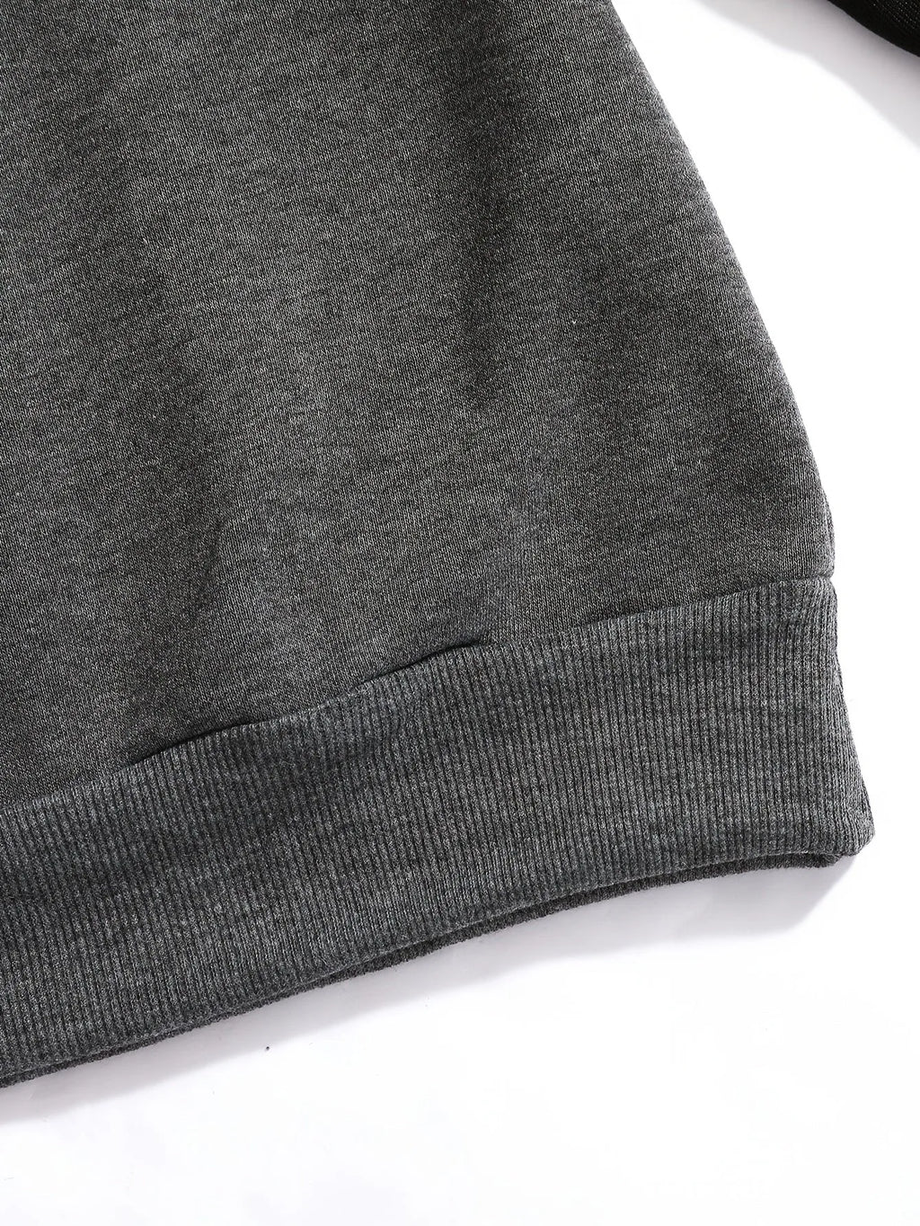 Close-up of the ribbed grey hem showing the fleece fabric texture