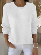White knit jumper front view highlighting ribbed trim at neckline and cuffs