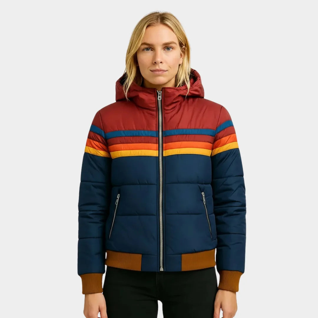 Front view of navy blue hooded puffer jacket with burgundy yoke and multicolour chest stripes, worn with black trousers