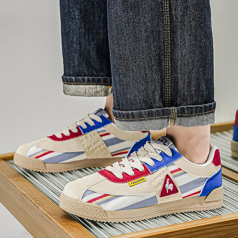 Pair of trainers displayed together showing matching colour-block design on both shoes