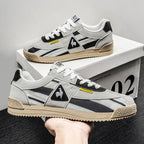Inner side view of trainer showing mesh panel and canvas stripe detail