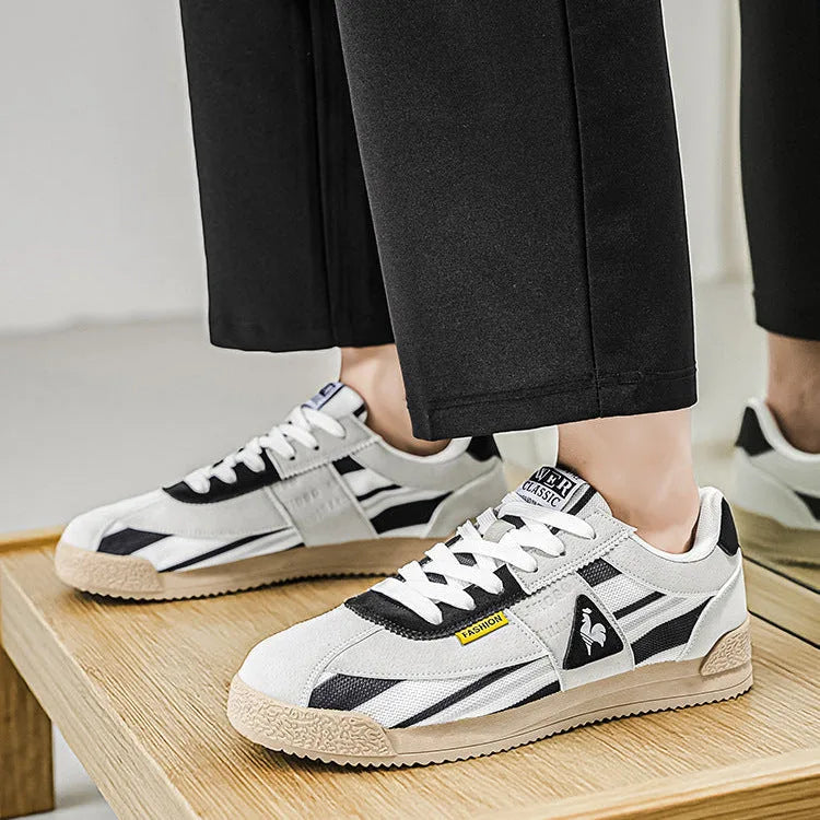 Full pair of trainers angled on white background showing overall silhouette and colour layout