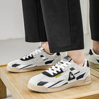 Full pair of trainers angled on white background showing overall silhouette and colour layout