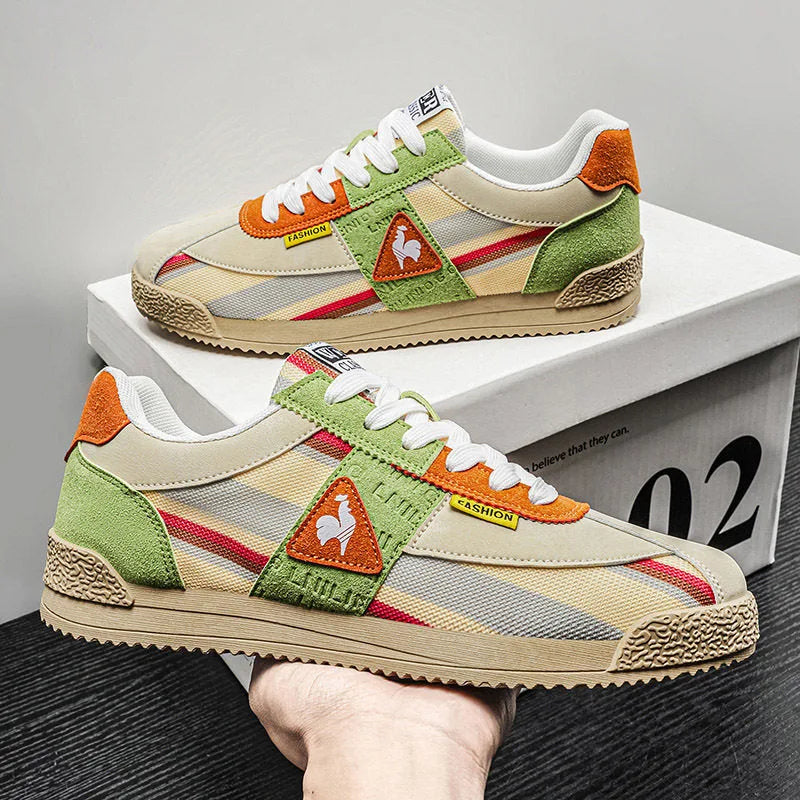 Pair of trainers in off-white and black colourway with striped panels and grooved sole