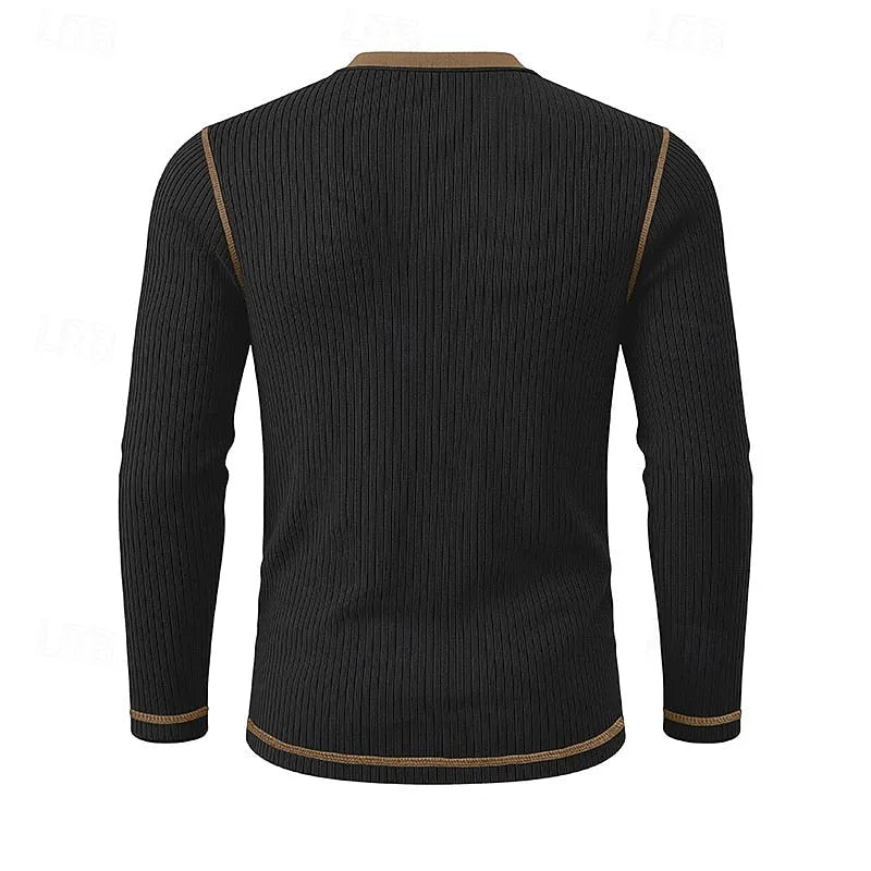 Close-up of the ribbed knit fabric texture on the light blue henley shirt