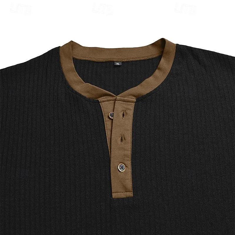 Cuff detail of the light blue ribbed henley shirt showing the brown contrast trim stitching