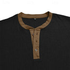 Cuff detail of the light blue ribbed henley shirt showing the brown contrast trim stitching