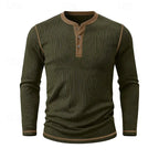 Man modelling the white ribbed henley shirt paired with beige trousers, full torso view