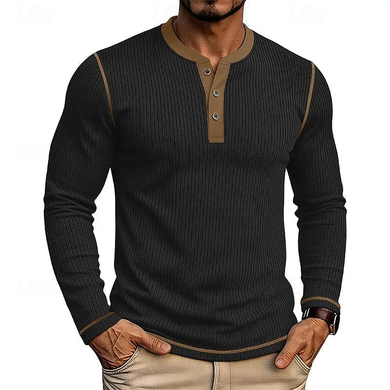 Detail of the hem and cuff contrast trim on the white ribbed henley long-sleeve shirt