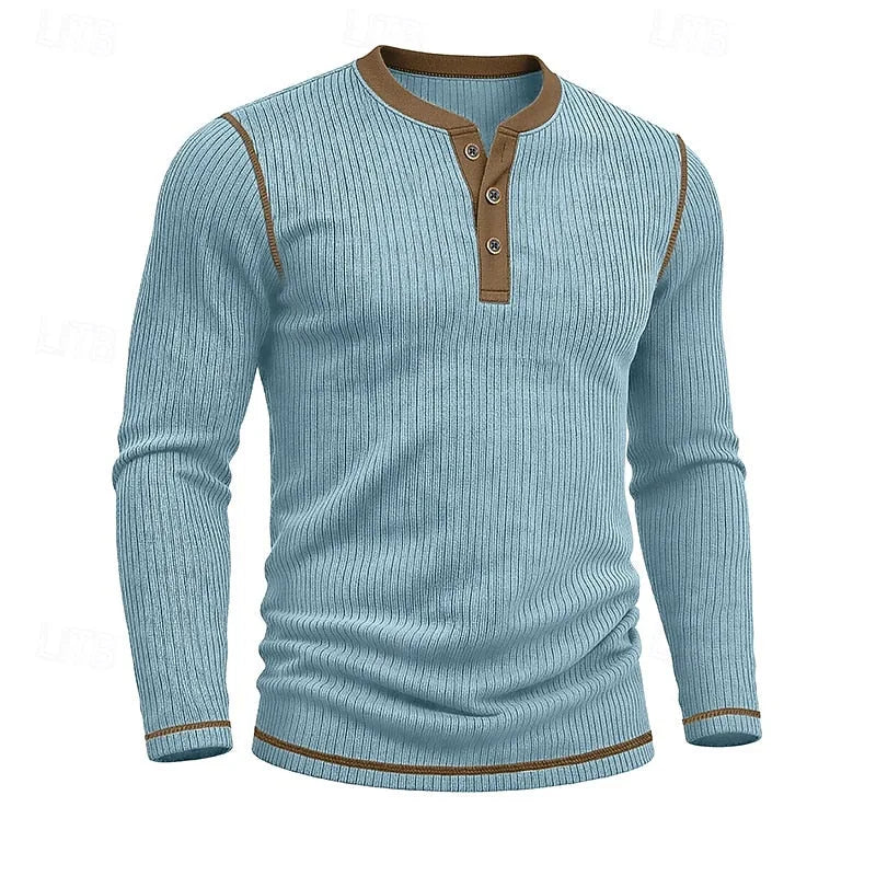 Close front shot of the light blue ribbed henley on a model, hands in trouser pockets