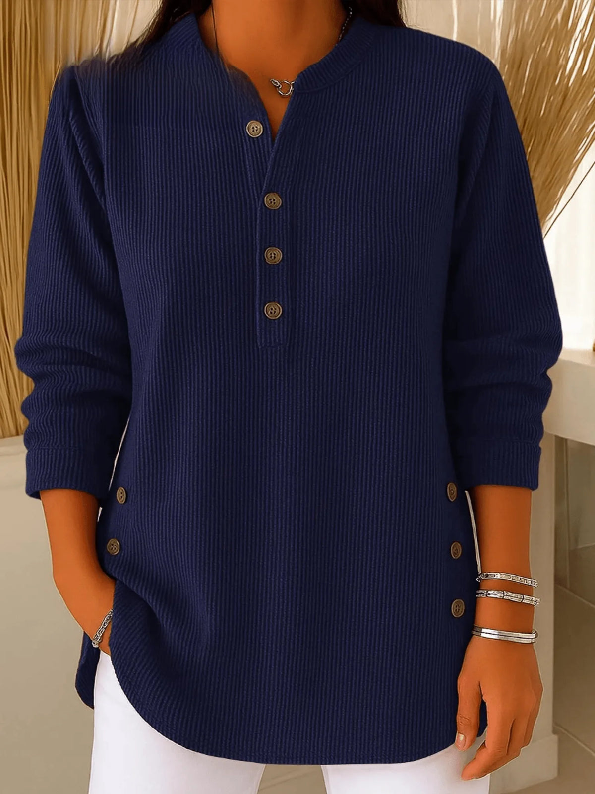 Navy blue ribbed Henley tunic top with long sleeves and visible side button trim near the hem