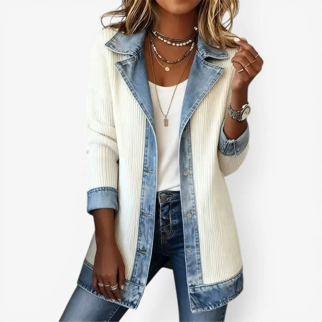 White ribbed knit jacket with denim lapel collar and cuffs, worn open over a white top and jeans