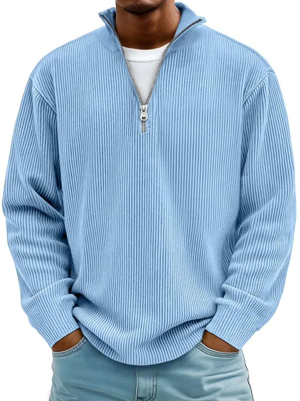 Front view of a sky blue ribbed knit quarter-zip jumper with stand collar and silver zip pull, worn with jeans