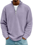 Close-up front shot of a lilac purple ribbed quarter-zip jumper showing the textured knit and open collar