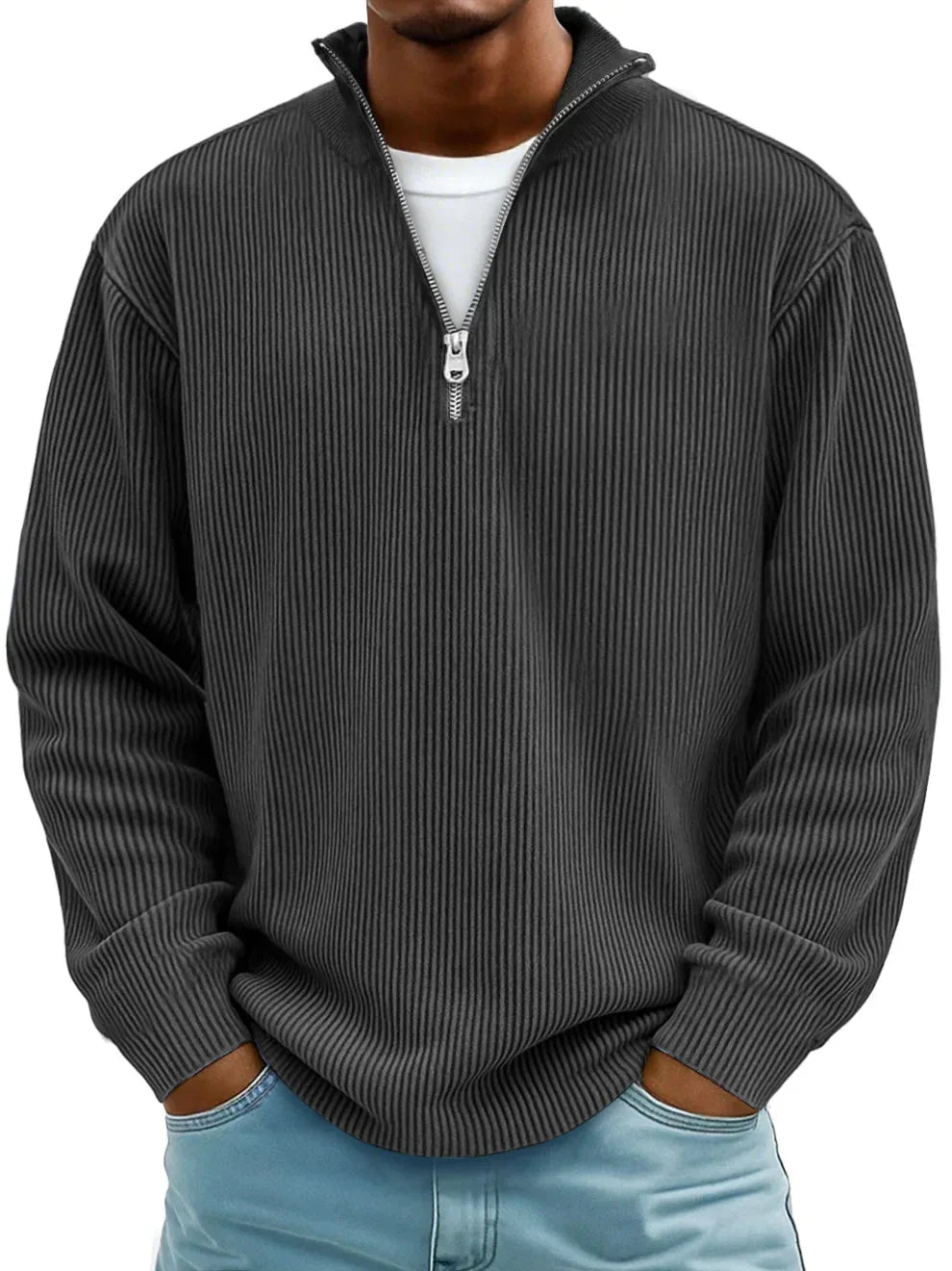 Charcoal grey ribbed quarter-zip jumper worn over a white tee, showing the relaxed long-sleeve fit