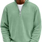 Sage green ribbed quarter-zip jumper shown on model, front view highlighting textured knit and zip collar
