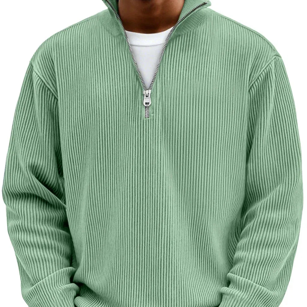 Sage green ribbed quarter-zip jumper shown on model, front view highlighting textured knit and zip collar