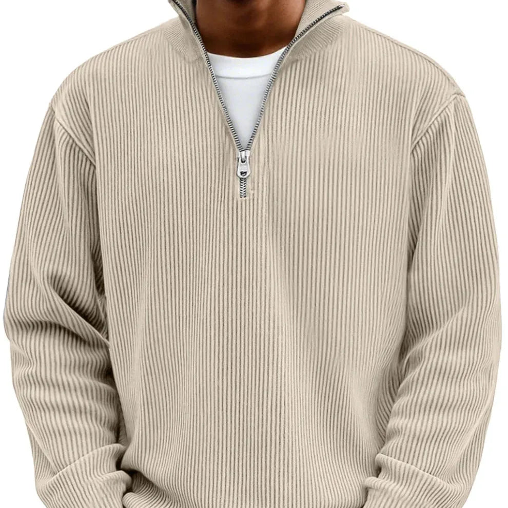 Beige ribbed quarter-zip jumper worn over a white t-shirt, front detail view of collar and zip
