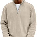Beige ribbed quarter-zip jumper worn over a white t-shirt, front detail view of collar and zip