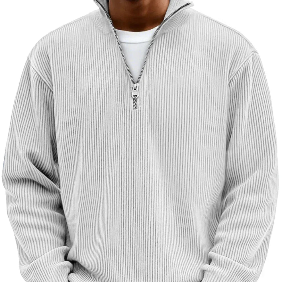 Light grey ribbed quarter-zip jumper on model, front view with half-zip collar open at the neck