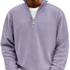 Olive green ribbed quarter-zip jumper, front view showing high stand collar and silver zip